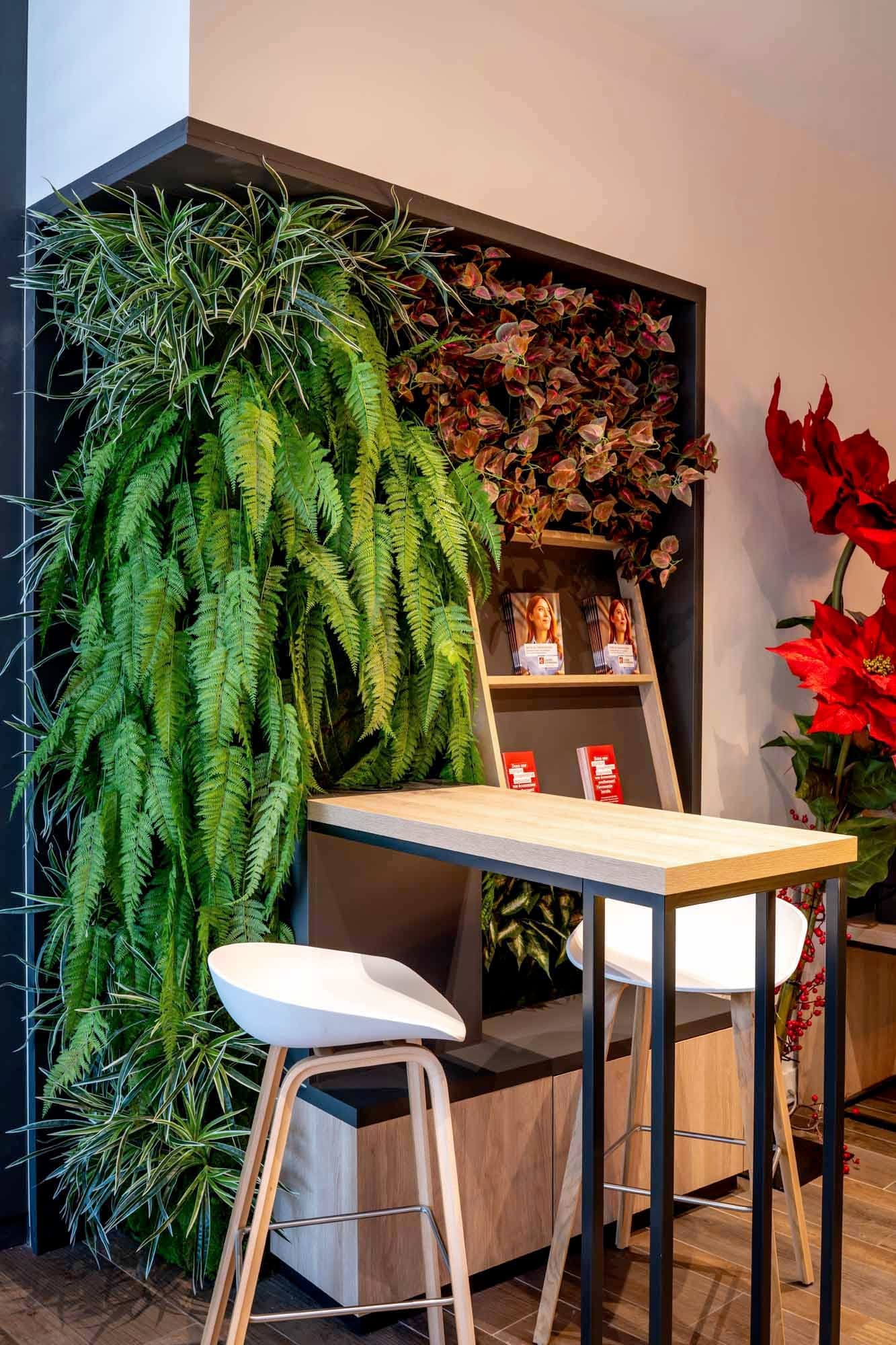 Standing table and planted niche.